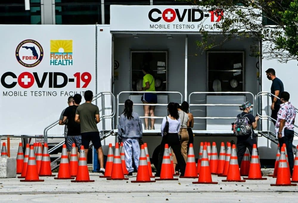 People line up at a walk-up COVID-19 testing site in Miami Beach, Florida on November 17, 2020. (Chandan Khanna/AFP via Getty Images)