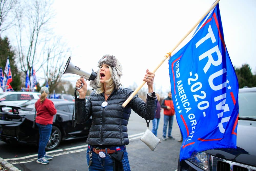 A woman shouts slogans as Trump Supporters gather during a car rally named as Stop the Steal on November 22, 2020 in Long Valley, New Jersey. (KENA BETANCUR/AFP via Getty Images)