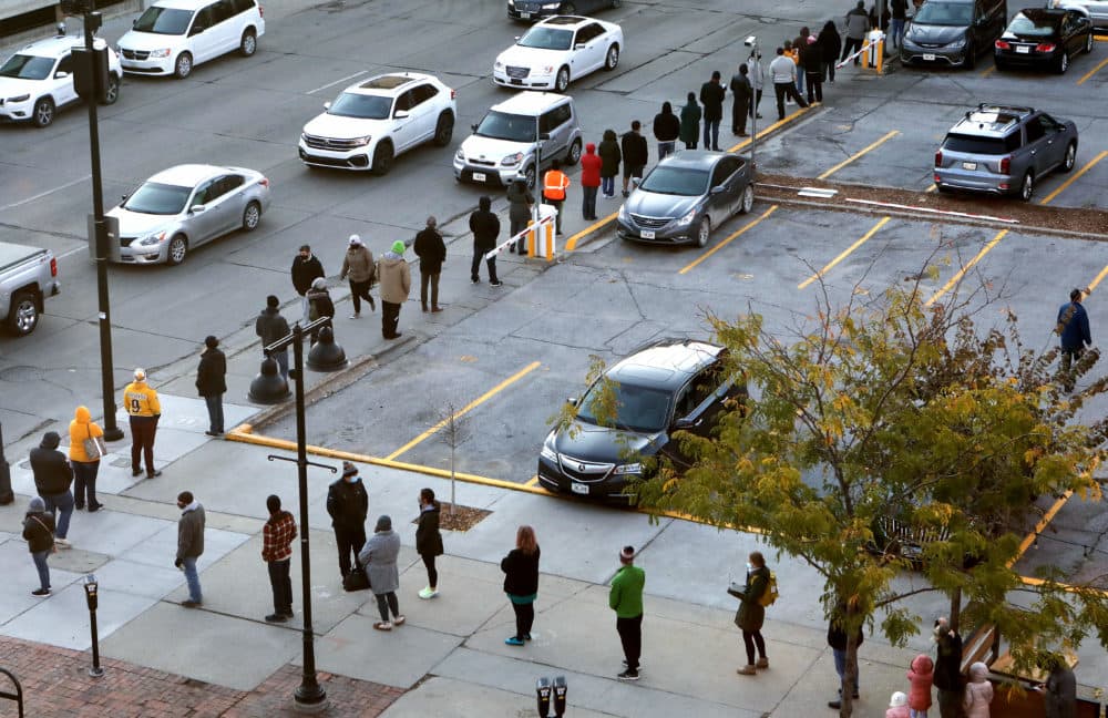 People wait in line to cast their ballots with social distance during early voting in the final days of the 2020 presidential election on October 30, 2020 in Des Moines, Iowa. (Mario Tama/Getty Images)