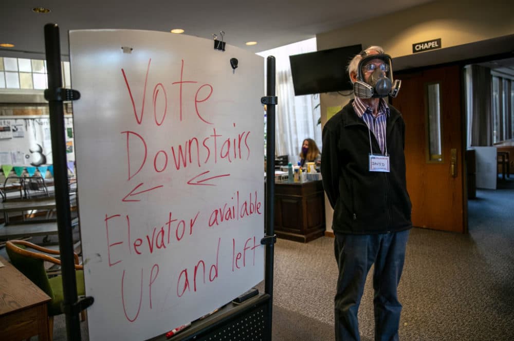 Election inspector David Hopkinson works at the Emanuel First Lutheran School polling center on November 03, 2020 in Lansing, Michigan. (John Moore/Getty Images)