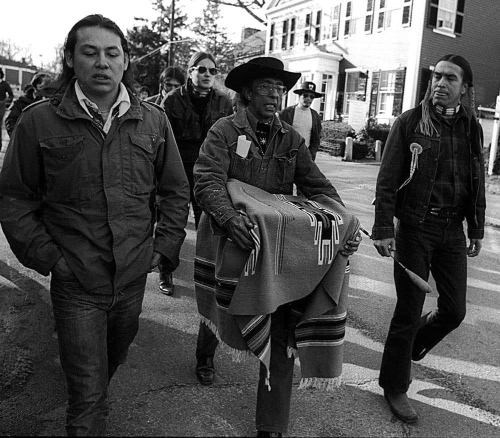Kisha James' grandfather (center) carrying a box. In the box are the Wampanoag human remains he and other National Day of Mourning protesters liberated from the Pilgrim Museum in 1974. (Courtesy of guest)