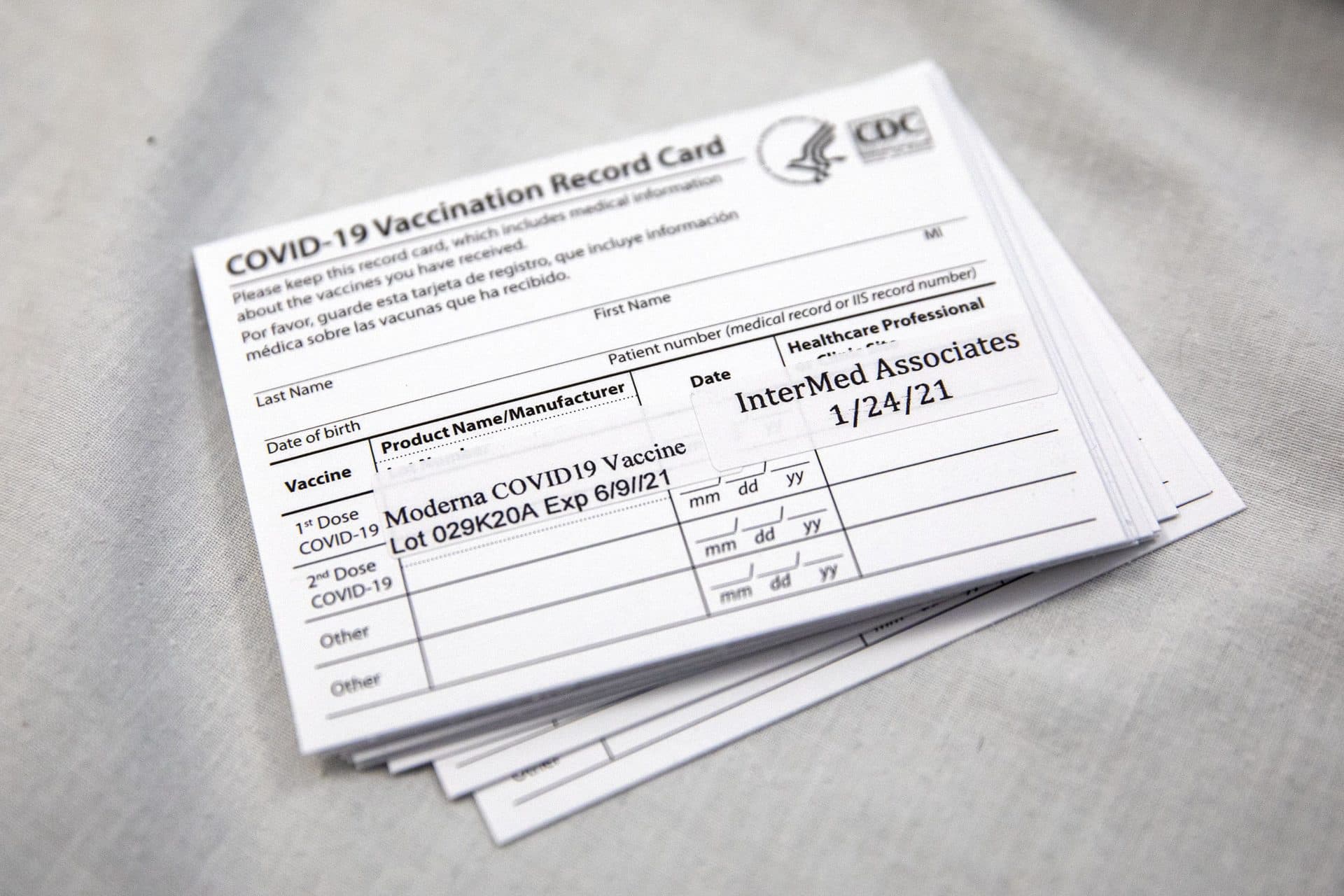 Vaccination cards handed out to patients at a local clinic. (Robin Lubbock/WBUR)