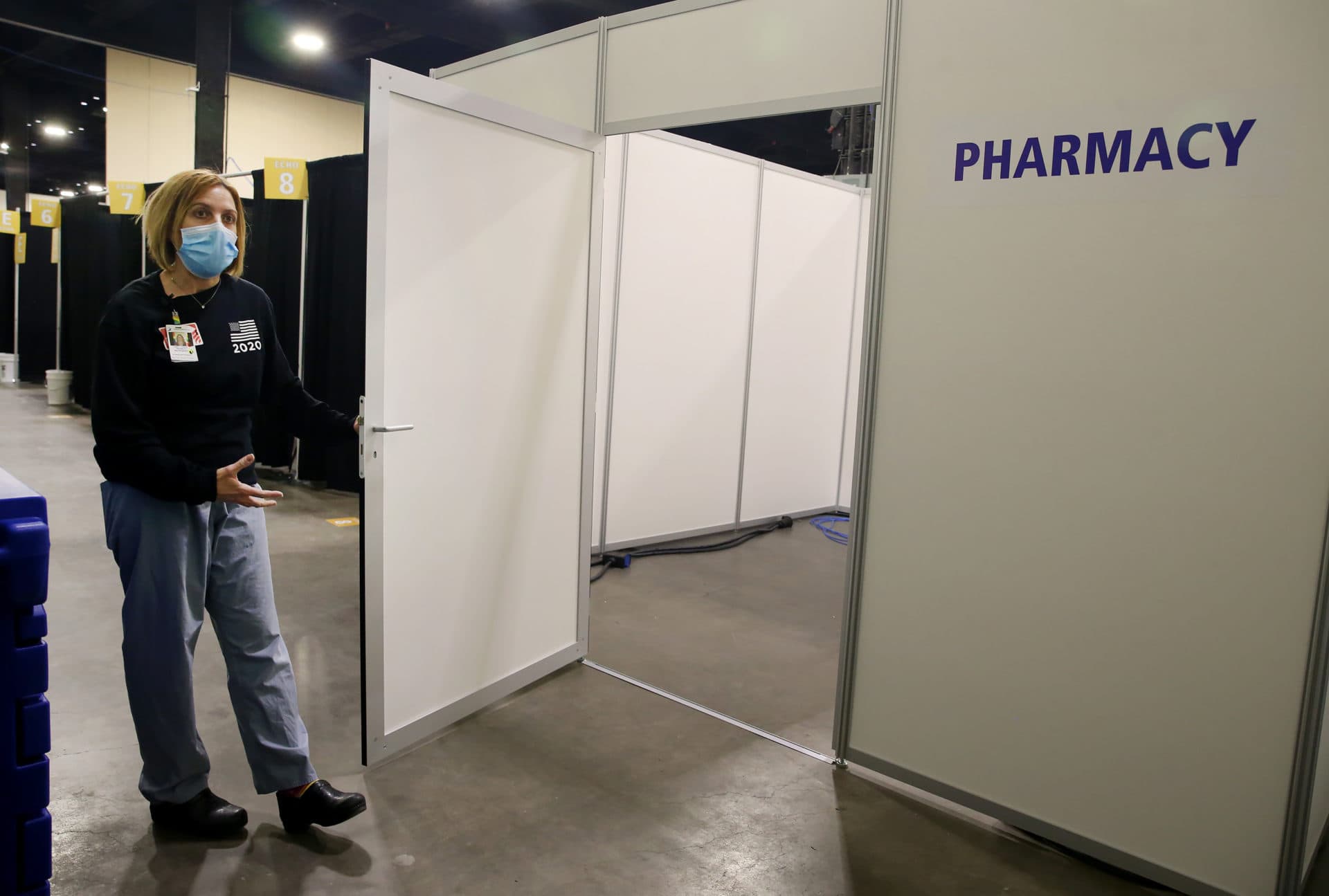 Janelle Forget, Associate Vice President of risk management, UMass Memorial, shows off a pharmacy at the DCU Center as it gears up to be used as a Covid field hospital for the second time. (Nancy Lane/MediaNews Group/Boston Herald)