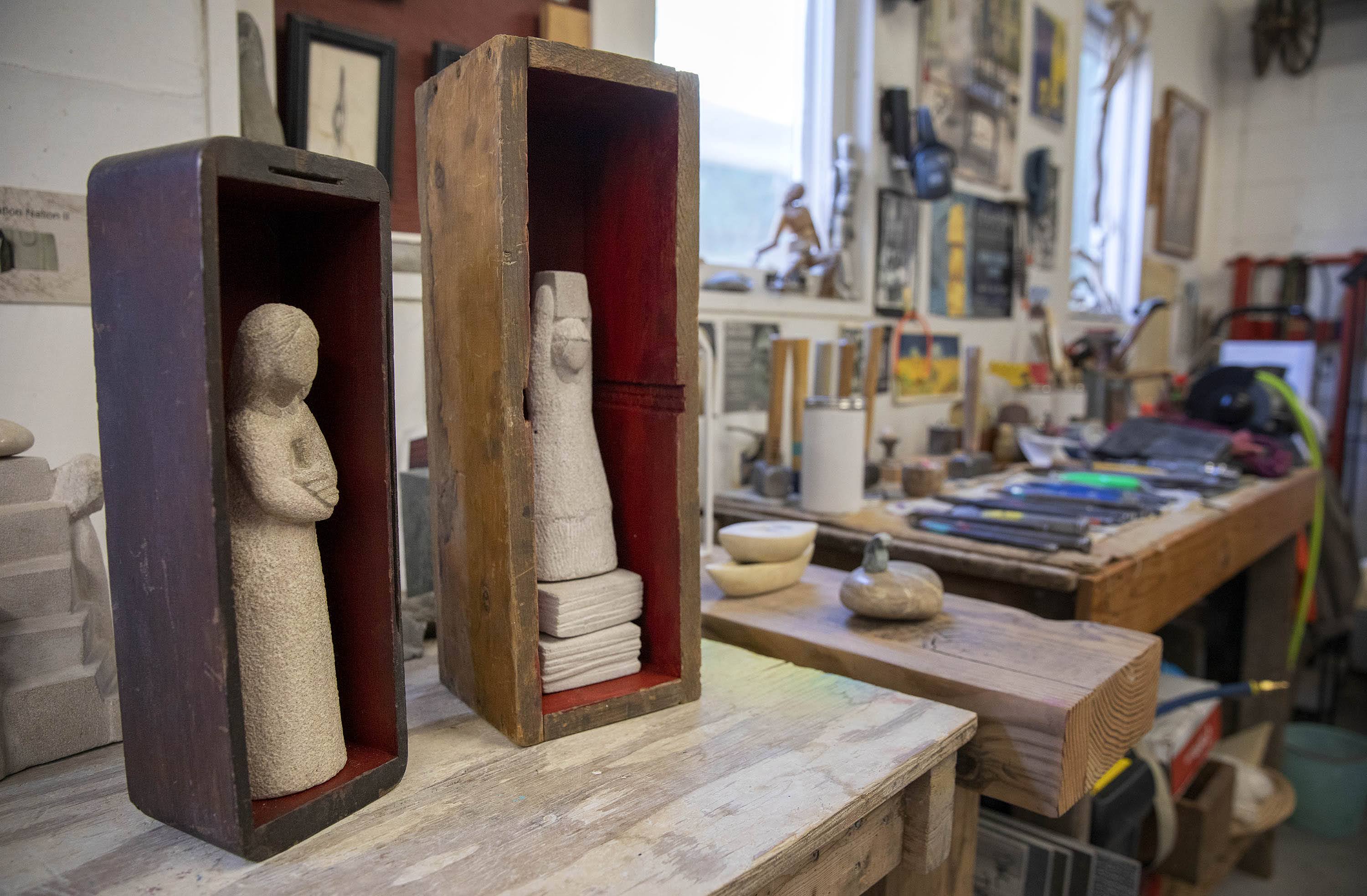 "Melted Heart" (left) by sculptor Nora Valdez in her studio at Humphreys Street Studios in Dorchester, Mass. (Robin Lubbock/WBUR)