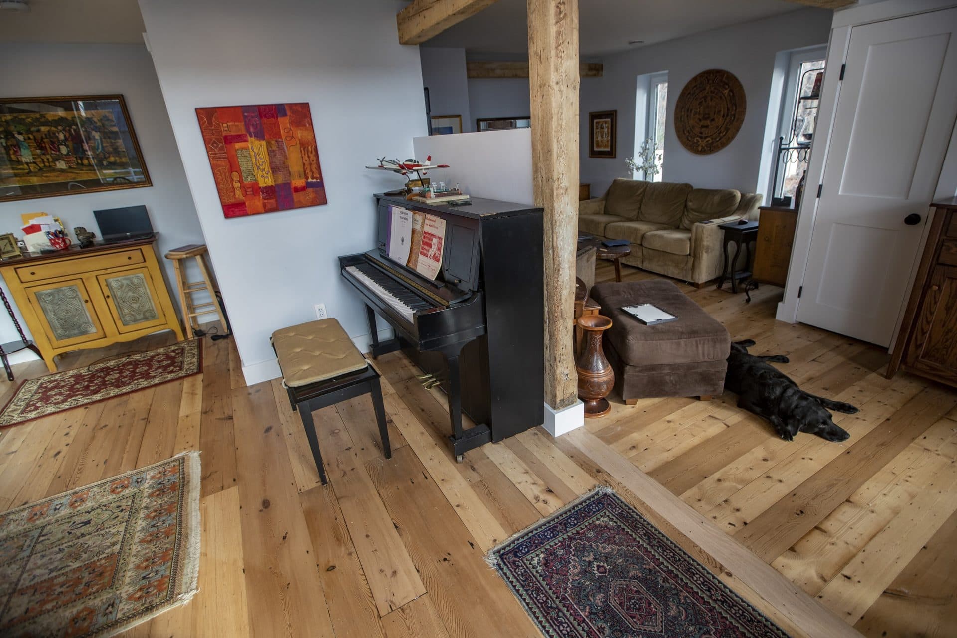 The entryway, dining and living areas in Simón Ríos’s restored barn. (Jesse Costa/WBUR)