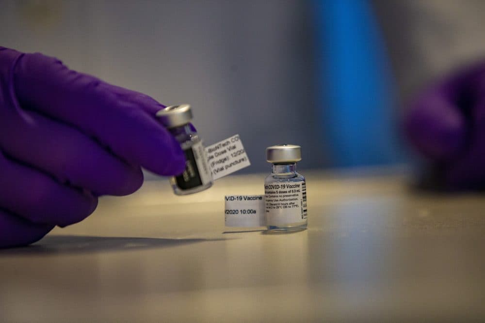 Two vials of Pfizer’s COVID-19 vaccine at Tufts Medical Center. (Jesse Costa/WBUR)