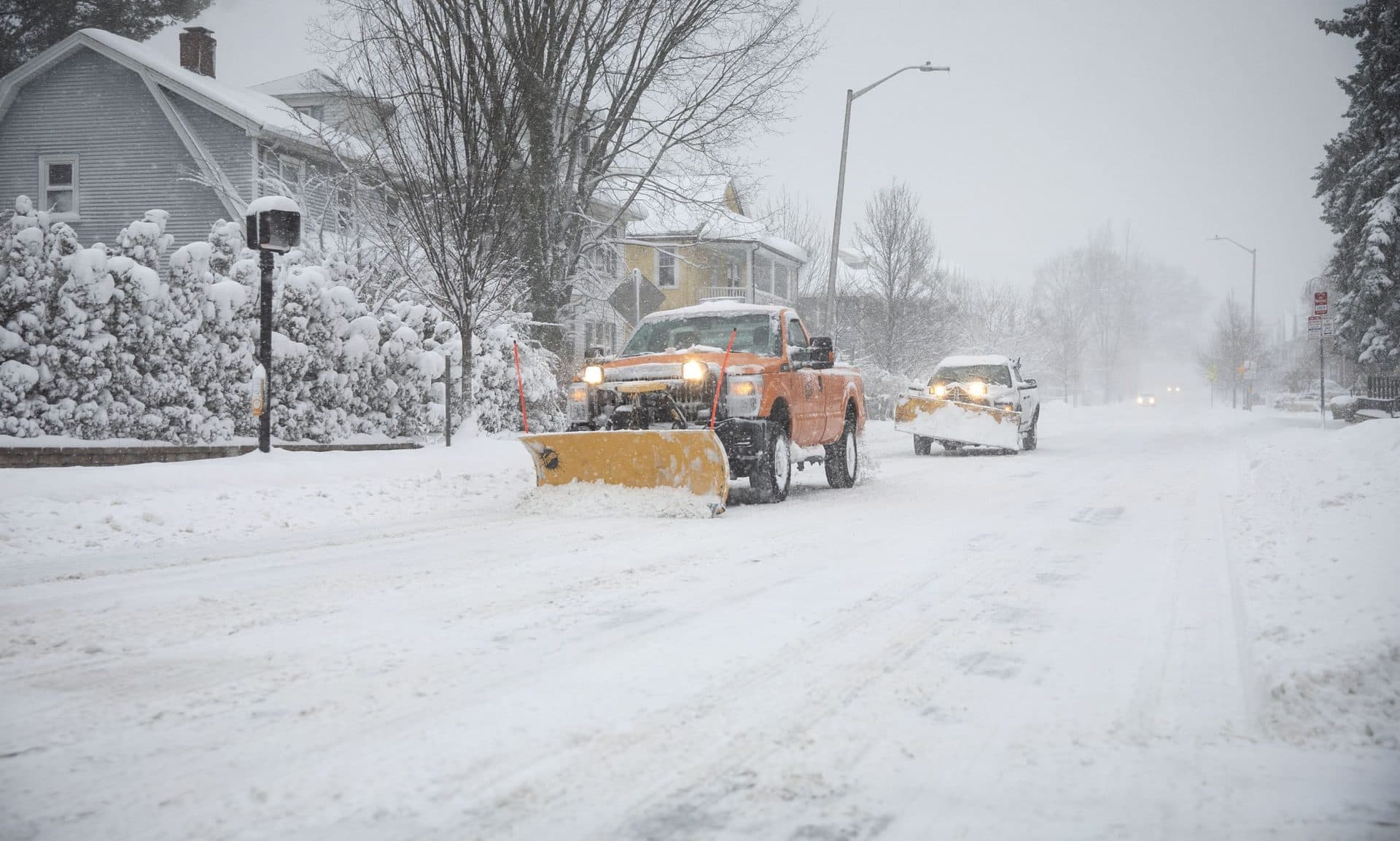 A snow plow clears a street on Thursday. (Robin Lubbock/WBUR)