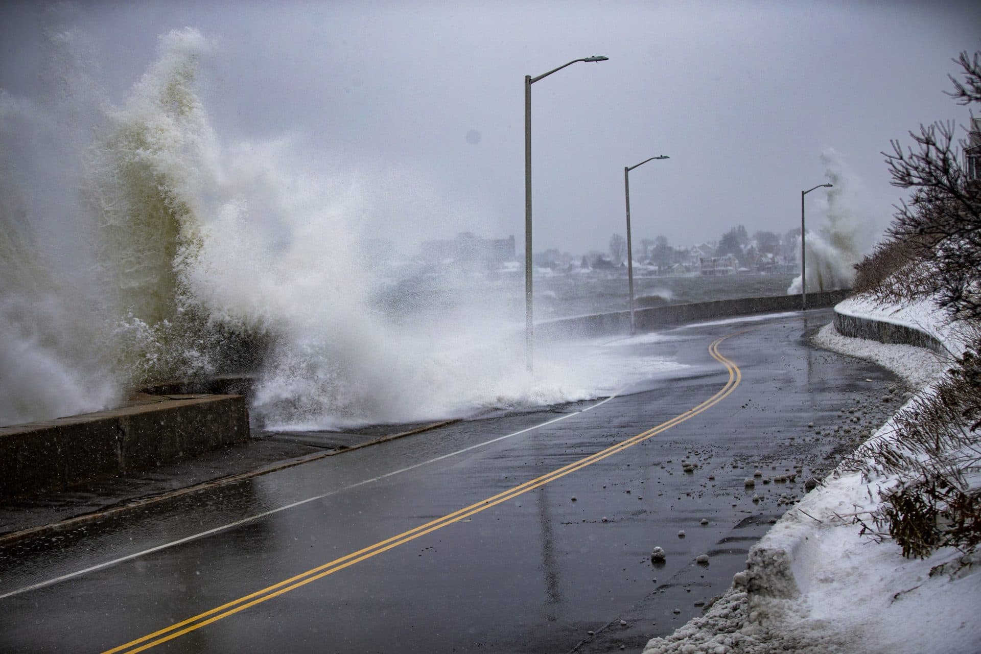 Waves crash along the seawall in Revere on Winthrop Parkway. (Jesse Costa/WBUR)