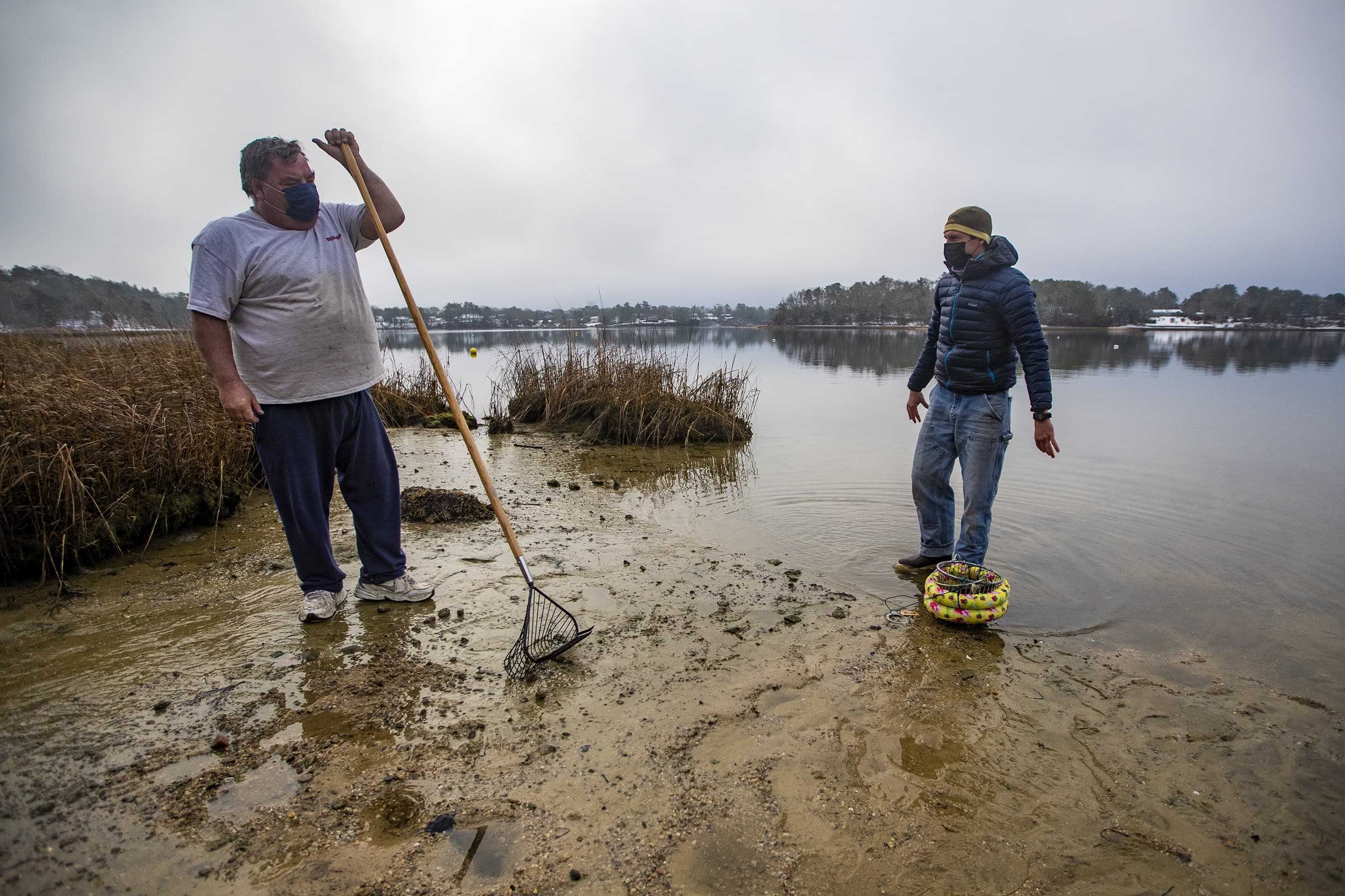 Oyster farmer Bruce Silverbrand, left, and coastal program manager for the Nature Conservancy, Steven Kirk, at Little Buttermilk Bay in Buzzards Bay. (Jesse Costa/WBUR)