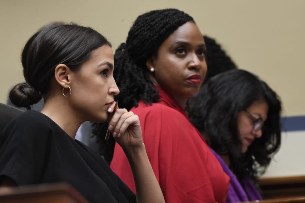 Massachusetts Congresswoman Ayanna Pressley, with Rep. Alexandria Ocasio-Cortez, of New York, and Rep. Rashida Tlaib, of Michigan, at a House Oversight Committee hearing in July, 2019. (Susan Walsh/AP)