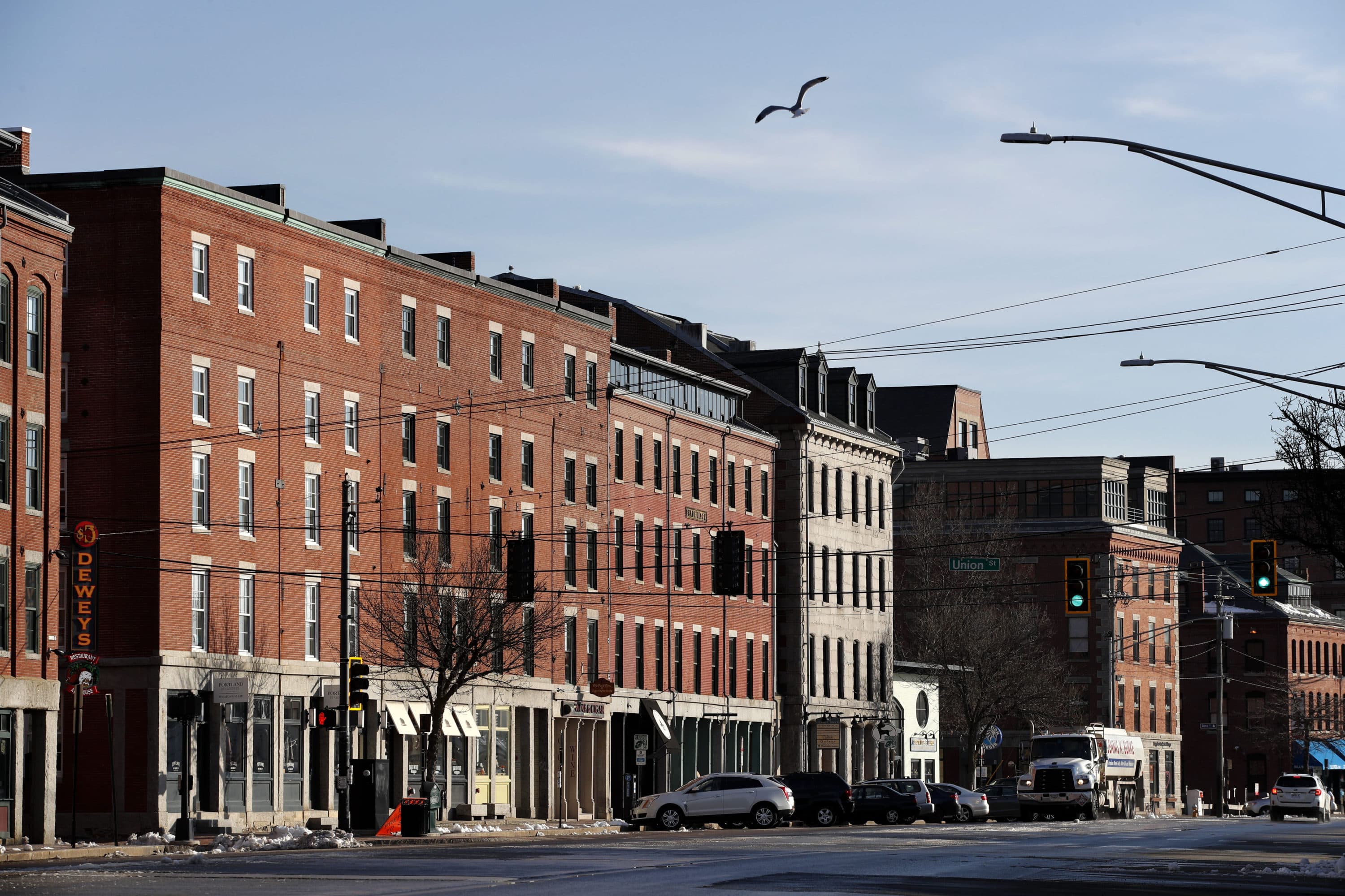 Commercial Street is nearly devoid of pedestrians and traffic on March 25, 2020 in Portland, Maine, just before a stay-at-home order went into place because of the pandemic. (Robert F. Bukaty/AP)