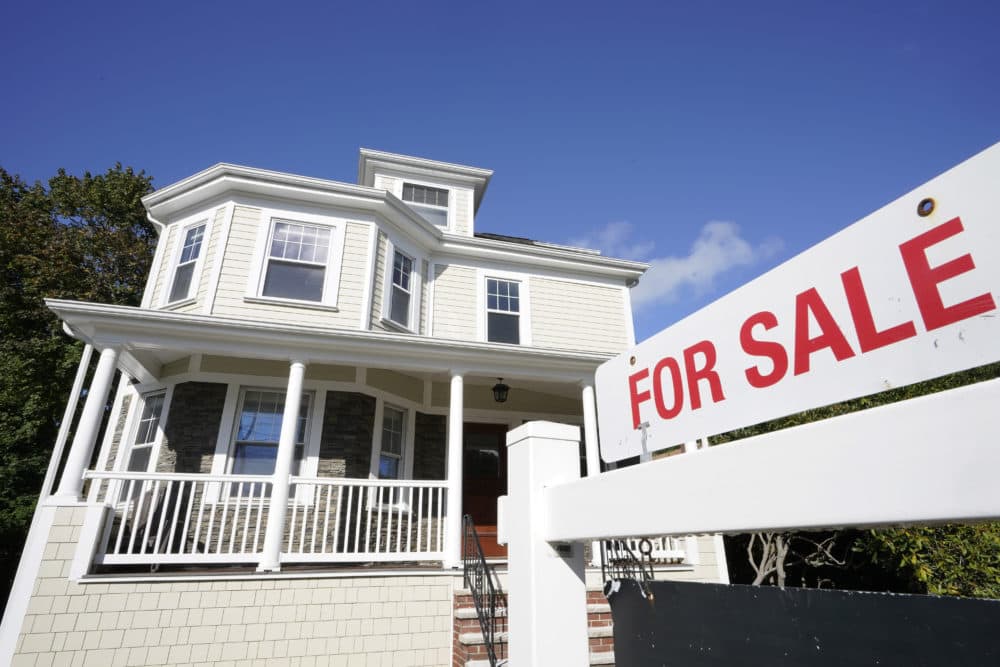 A for sale sign stands in front of a house, Tuesday, Oct. 6, 2020, in Westwood, Mass. (AP Photo/Steven Senne)