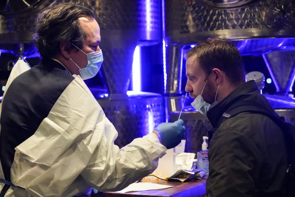 A medical professional administers a COVID-19 test to enter City Winery Tuesday, Nov. 24, 2020, in New York. City Winery will be the first restaurant in the nation to create a &quot;100% COVID-tested space&quot;. The program will run every Tuesday and Wednesday evening for the remainder of 2020. (Frank Franklin II/AP)