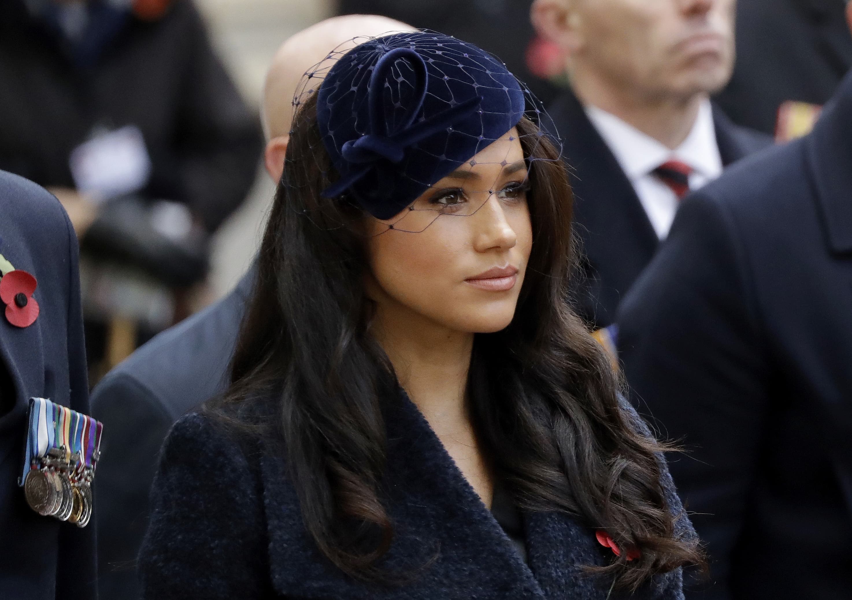 In this Thursday, Nov. 7, 2019 file photo Meghan the Duchess of Sussex stands after she and her husband Britain's Prince Harry placed a Cross of Remembrance as they attend the official opening of the annual Field of Remembrance at Westminster Abbey in London. The Duchess of Sussex has revealed that she had a miscarriage in July. Meghan described the experience in an opinion piece in the New York Times on Wednesday. She wrote: "I knew, as I clutched my firstborn child, that I was losing my second." The former Meghan Markle and husband Prince Harry have a son, Archie, born in 2019. (Matt Dunham/AP)