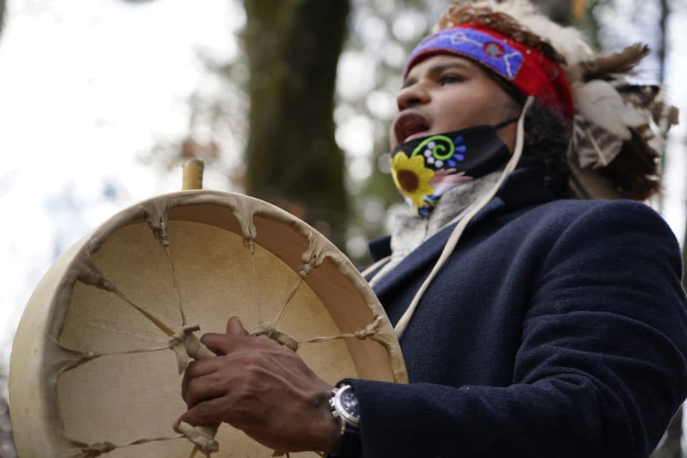 Larry Fisher, chief sachem of the Mattakeeset Massachuset tribe, sings and drums a traditional song honoring their land and ancestry at Titicut Indian Reservation, Nov. 27, 2020, in Bridgewater, (Elise Amendola/AP)