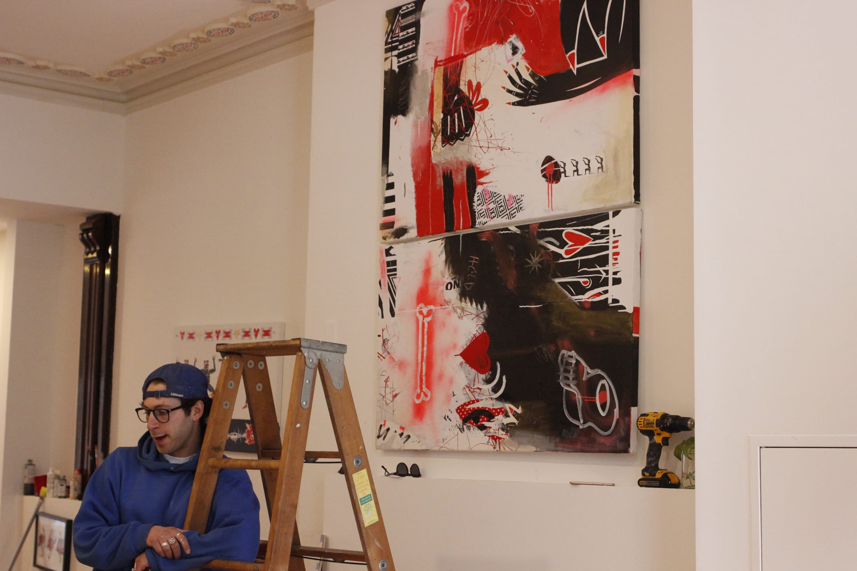 Local artist Sam Fish in his temporary gallery at 254 Newbury Street in March 2020, days before his gallery opening was canceled due to the COVID-19 pandemic. (Jenn Stanley/WBUR)