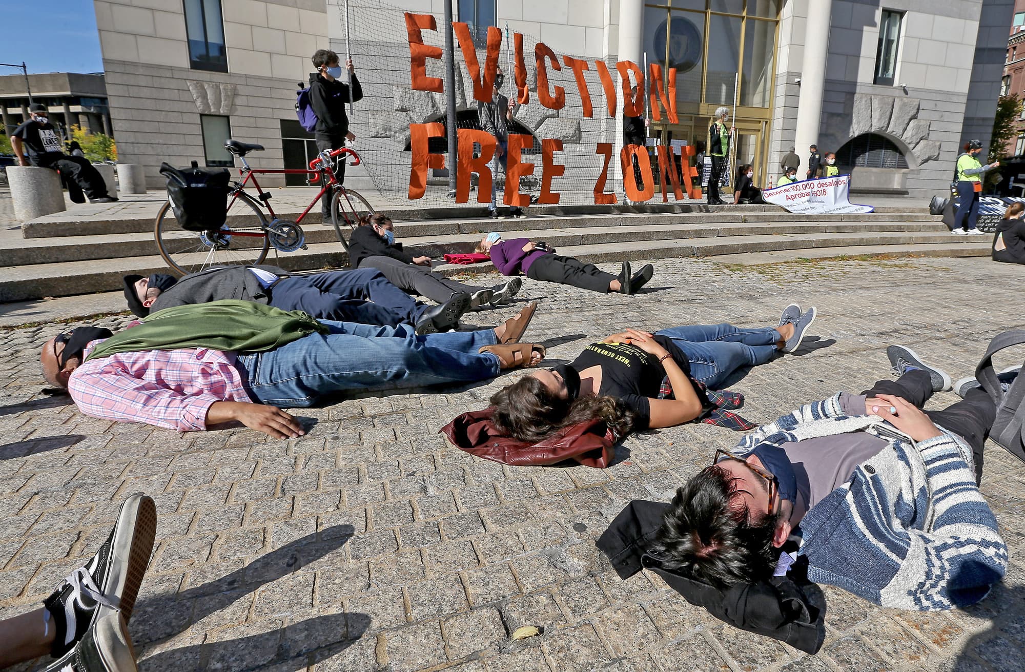 Protesters lay down during a rally to prevent Massachusetts evictions in front of Boston Housing Court on Oct. 15, 2020 in Boston, Massachusetts. (Matt Stone/ MediaNews Group/Boston Herald)