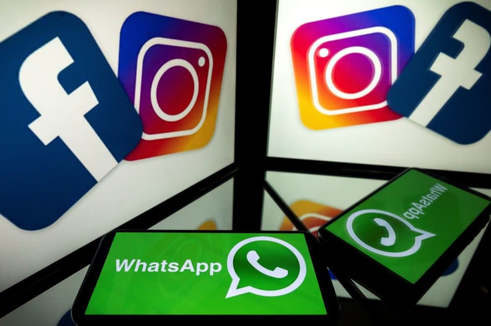 Logos of US social networks Facebook, Instagram and mobile messaging service WhatsApp on the screens of a smartphone and a tablet. (Lionel Bonaventure/AFP via Getty Images)