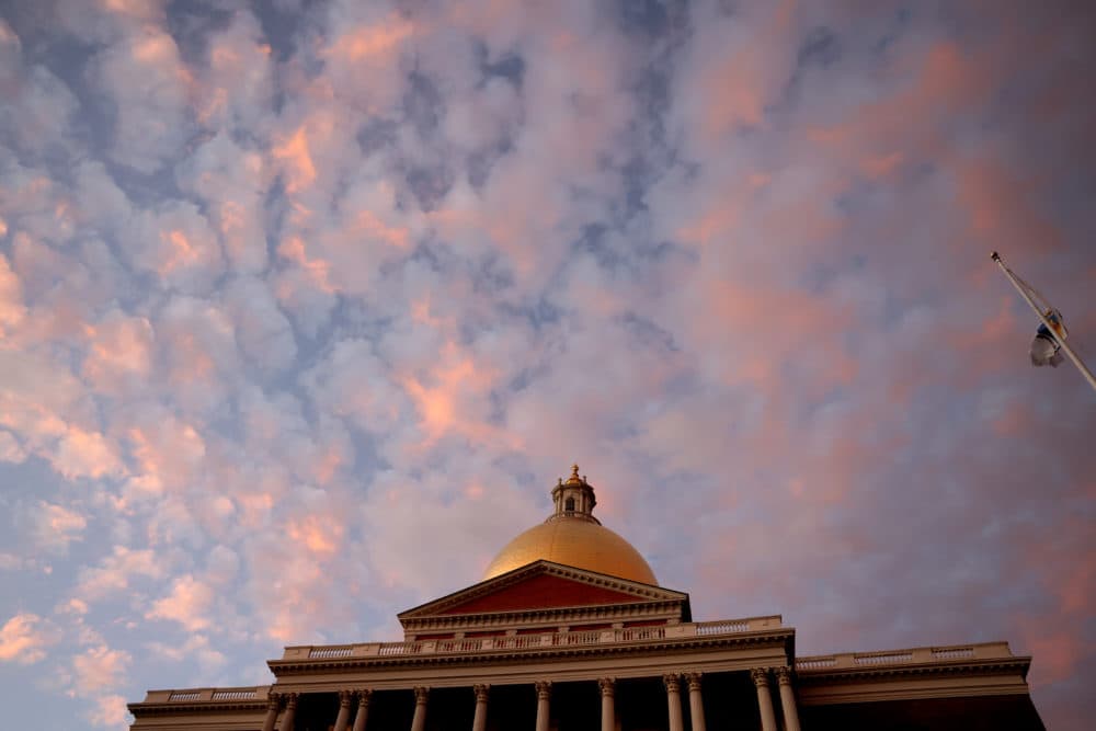 The sunset was seen above the State House while inside lawmakers were expected to vote on a police reform bill at the Massachusetts State House in Boston on Dec. 1. (Jessica Rinaldi/The Boston Globe via Getty Images)