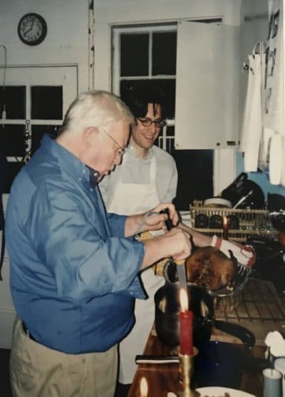 Karl, the author's son-in-law (in white), and Eric, her husband, in the midst of cooking the Christmas goose on December 24, 2002. (Courtesy)