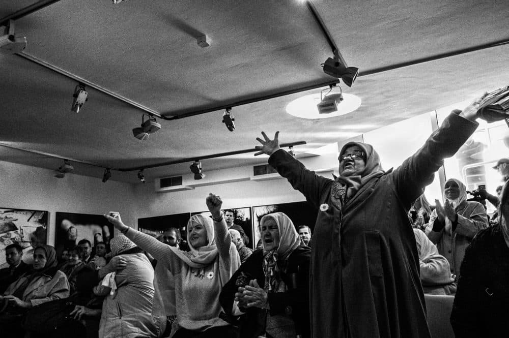 In 2017, Nedžiba Salihović and other Srebrenica widows celebrate the conviction of Bosnian Serb General Ratko Mladić for his role in the 1995 genocide at Srebrenica. Salihović lost her husband and son in the massacre. (Ron Haviv)