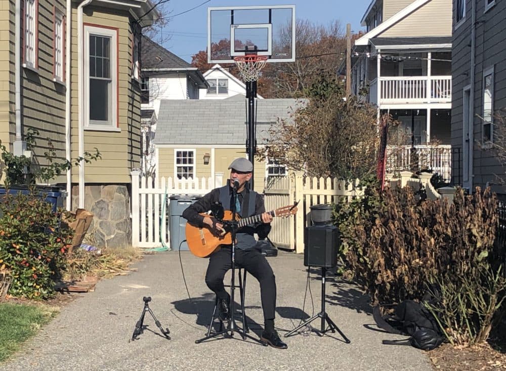 Gian Carlo Buscaglia lucked out with the weather for this November serenade in Roslindale. (Andrea Shea/WBUR)