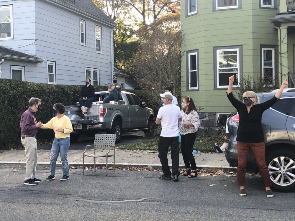 Trisha Zembruski, right, hired Gian Carlo Buscaglia to serenade her neighborhood, not once, but twice, to help support him during the pandemic. (Andrea Shea/WBUR)