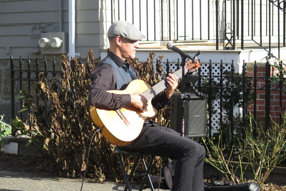 Winter is coming, Gian Carlo Buscalgia said, so he'll be taking his serenades online when it's too cold to play outdoors. (Andrea Shea/WBUR)