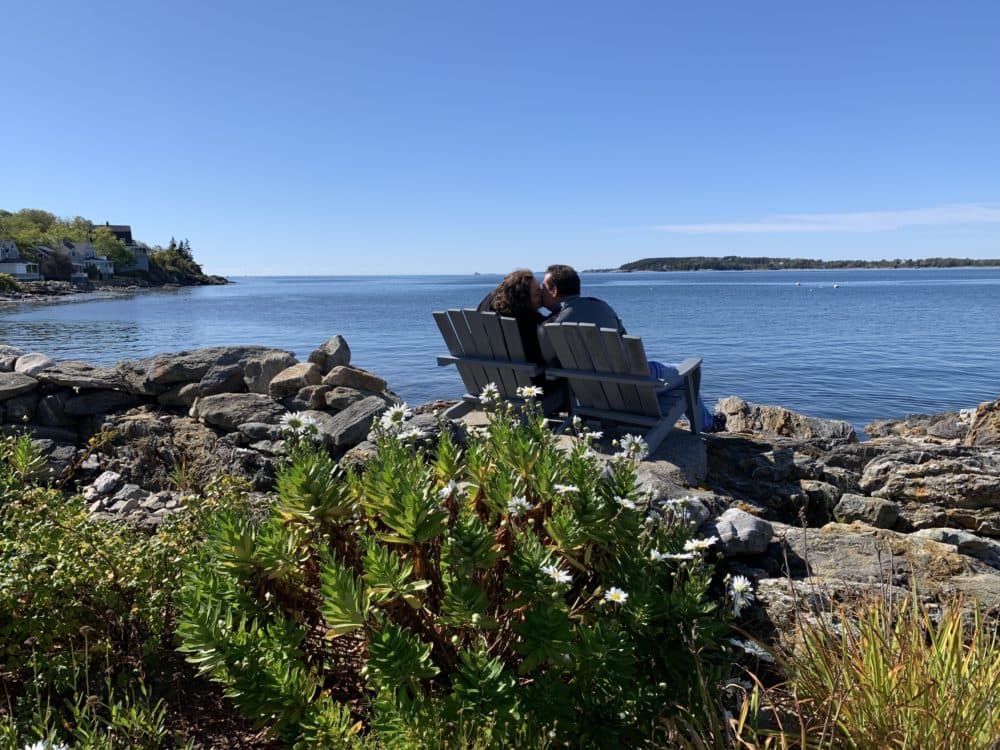 Karen and Steven share a kiss in the Adirondack chairs at the Ocean Point Inn in East Booth Bay, Maine. (Courtesy Karen Nascembeni)