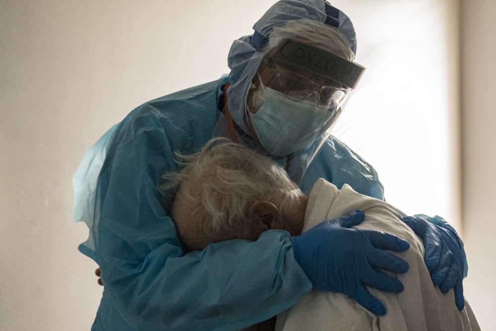 Dr. Joseph Varon hugs and comforts a patient in the COVID-19 intensive care unit during Thanksgiving at the United Memorial Medical Center on November 26, 2020 in Houston, Texas. (Photo by Go Nakamura/Getty Images)