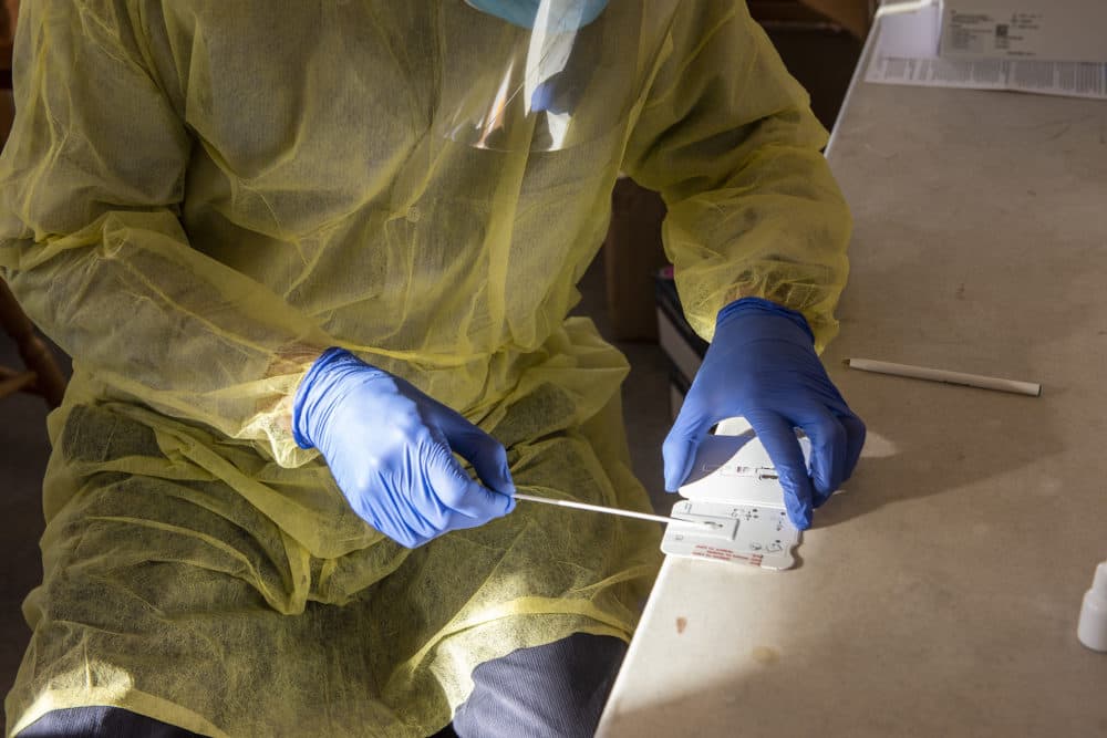 Park County Health Department Director Alex Baukus performs COVID-19 test using the Abbott BinaxNOW rapid test at the Fairgrounds on Dec. 7 in Livingston, Montana. (William Campbell/Getty Images)