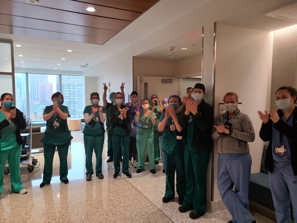 Health care workers cheer for recovered coronavirus patient Jeff Gerson as he leaves the hospital (Courtesy)