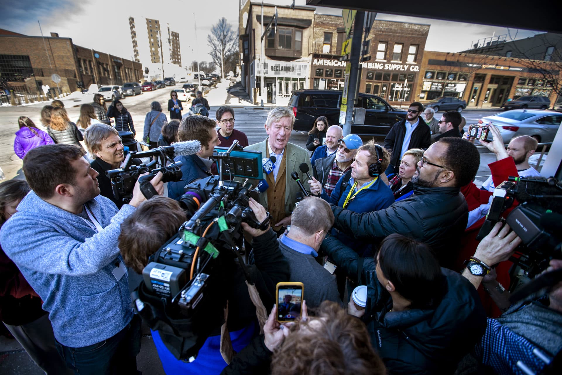 Republican presidential candidate and former Massachusetts Gov. William Weld speaks with press during a campaign stop on East Grand Avenue in Des Moines. (Jesse Costa/WBUR)