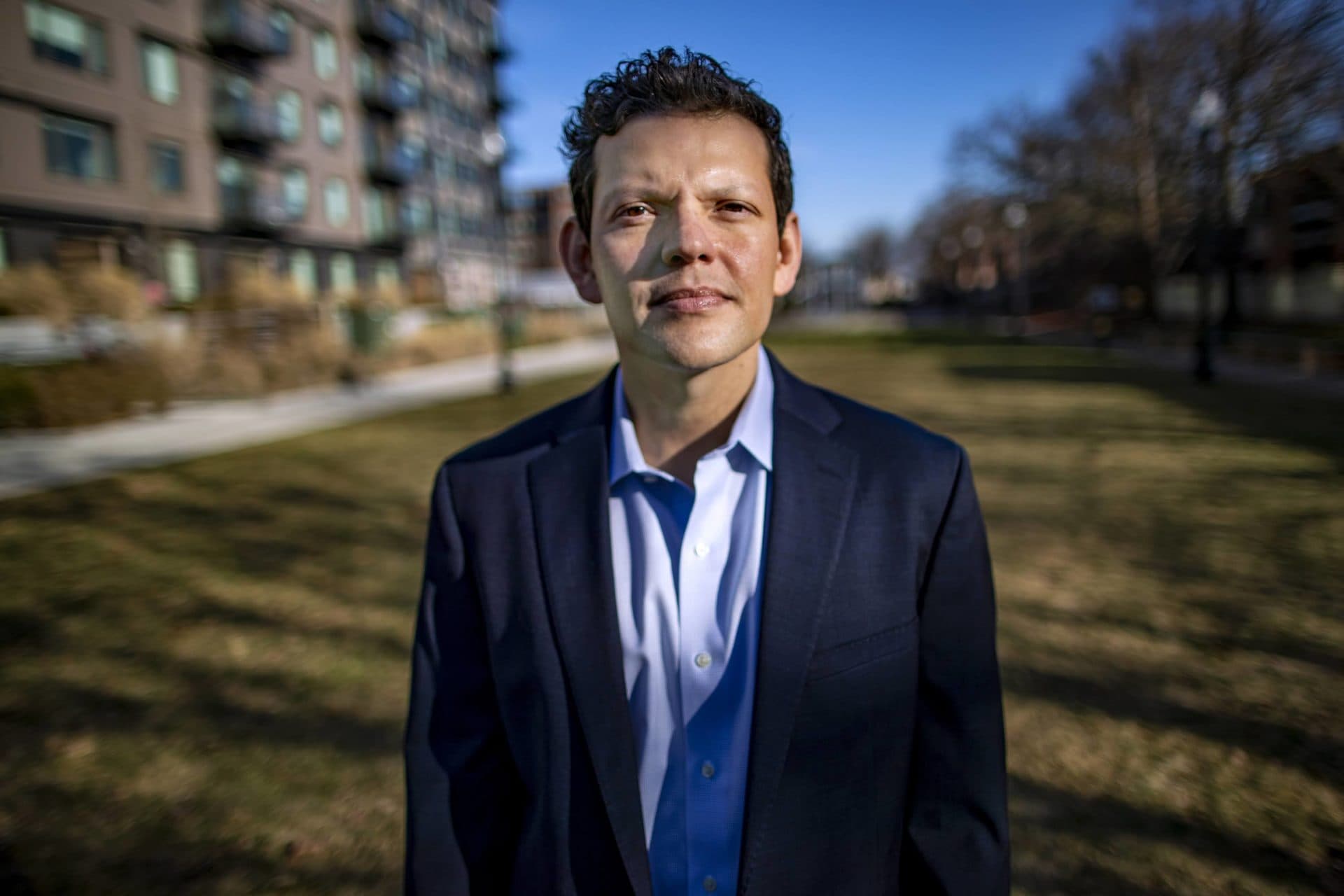 Iván Espinoza-Madrigal remembers growing up in Costa Rica, the civil unrest of Central America. His mother brought them here so they wouldn't have to live through that. The day of the riots as people stormed the capitol, his mother questioned why they came to America to begin with. (Jesse Costa/WBUR)