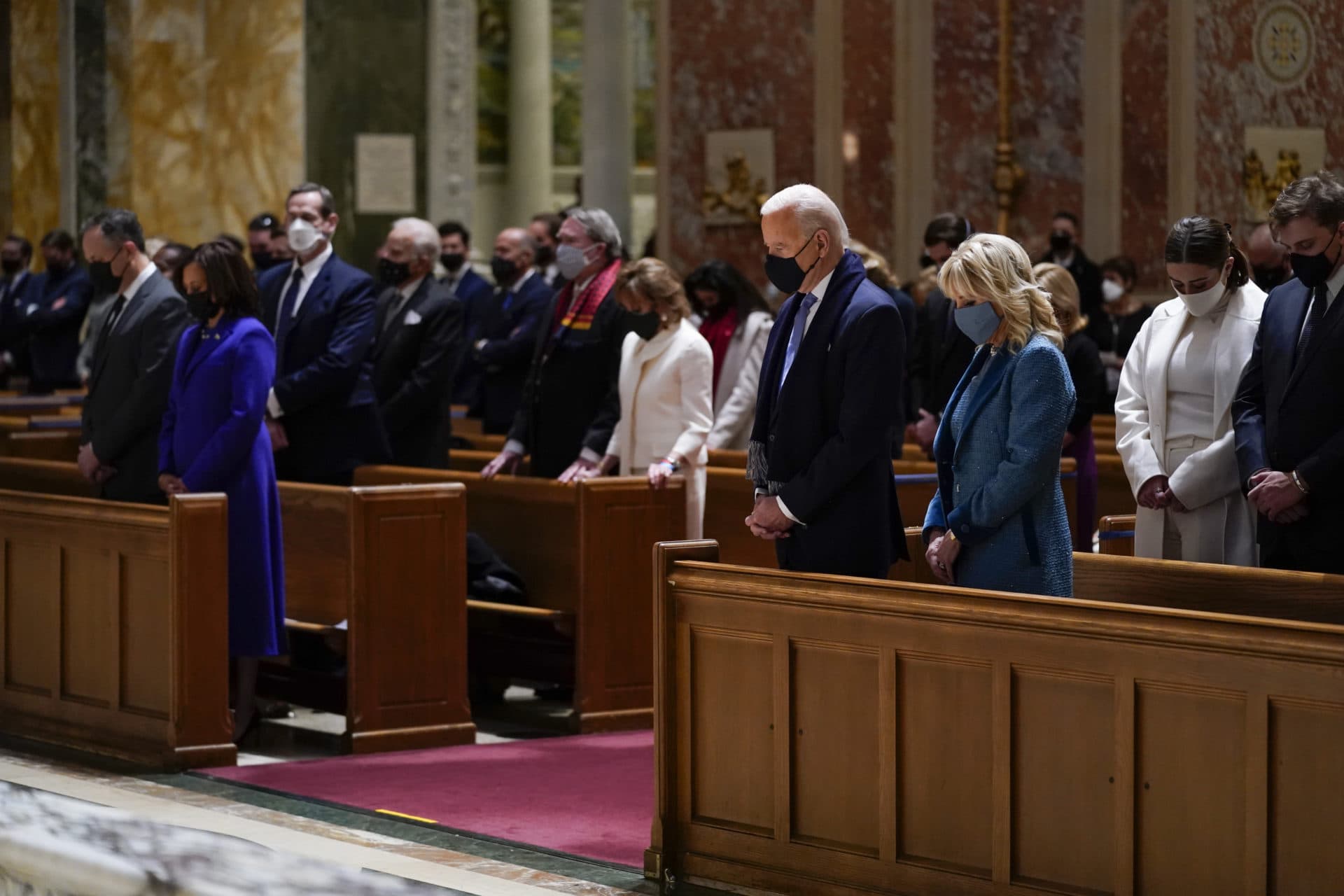 The Bidens attend Mass at the Cathedral of St. Matthew the Apostle on Wednesday morning ahead of the inauguration ceremony. Harris and her husband Doug Emhoff are at left. (Evan Vucci/AP)
