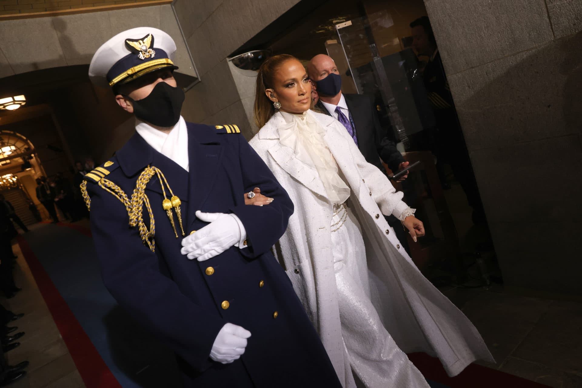 Jennifer Lopez is escorted to the inauguration to perform ahead of Biden's swearing in. (Win McNamee/Getty Images)