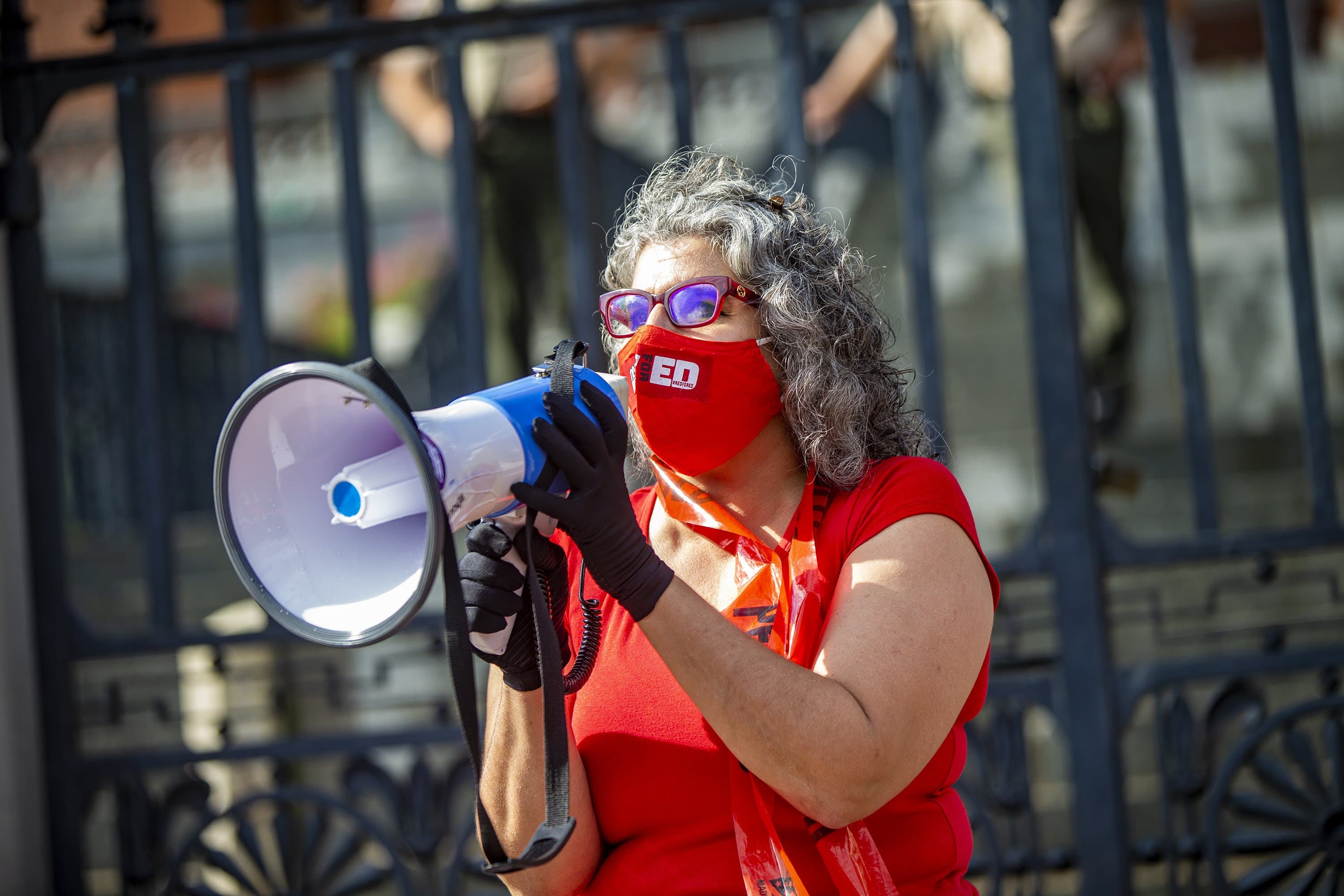 Massachusetts Teachers Union President Merrie Najimy speaks to the hundreds of members of the Massachusetts Teachers Union who attended the rally at the State House demanding Governor Charlie Baker to safely reopen schools. (Jesse Costa/WBUR)