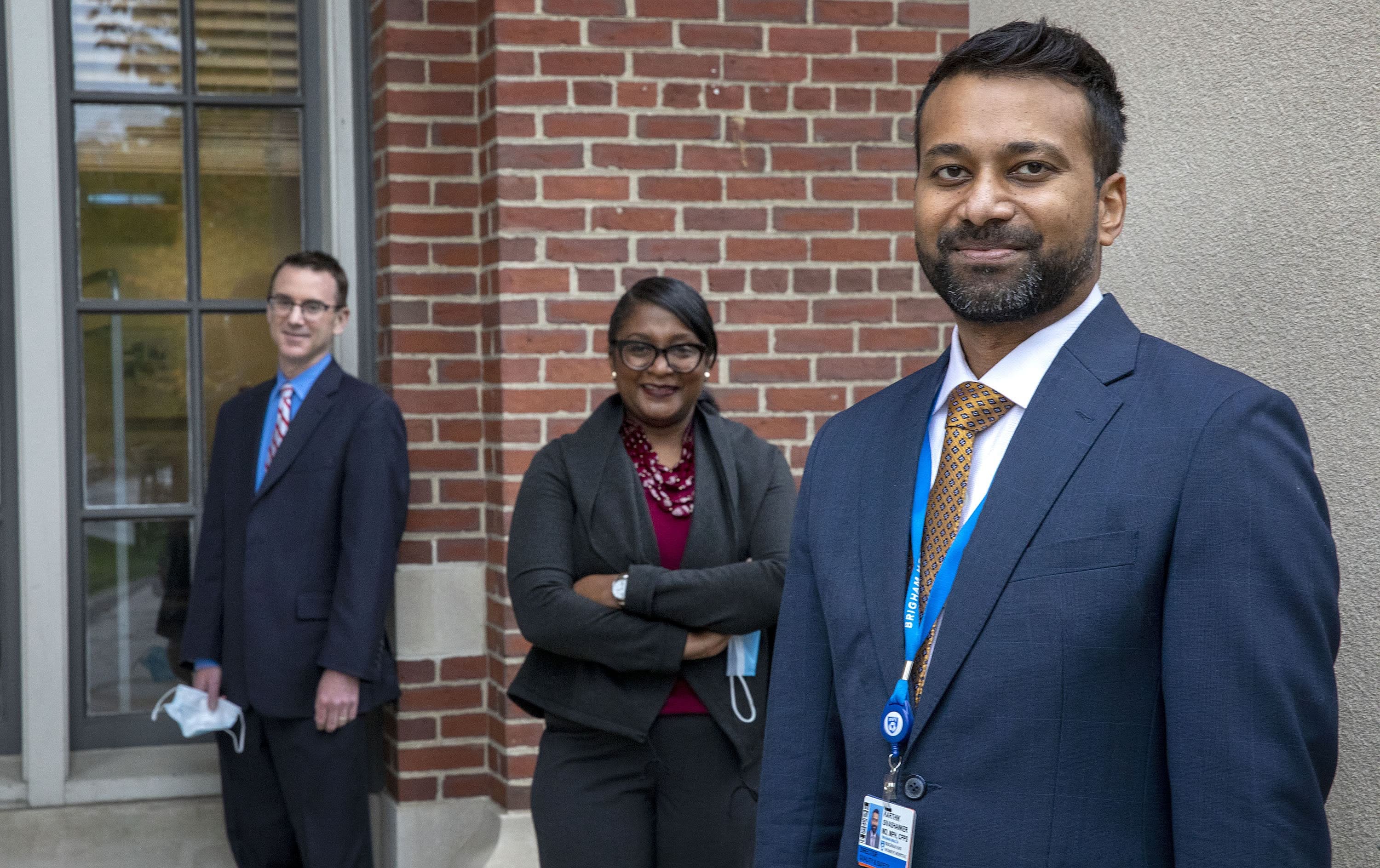 Karthik Sivashanker Medical Director of Quality, Safety, and Equity at Brigham and Women's Hospital, with colleagues Normella Walker, Exec Director of Diversity Equity and Inclusion, and Chief Quality and Safety Officer Andrew Resnick. (Robin Lubbock/WBUR)