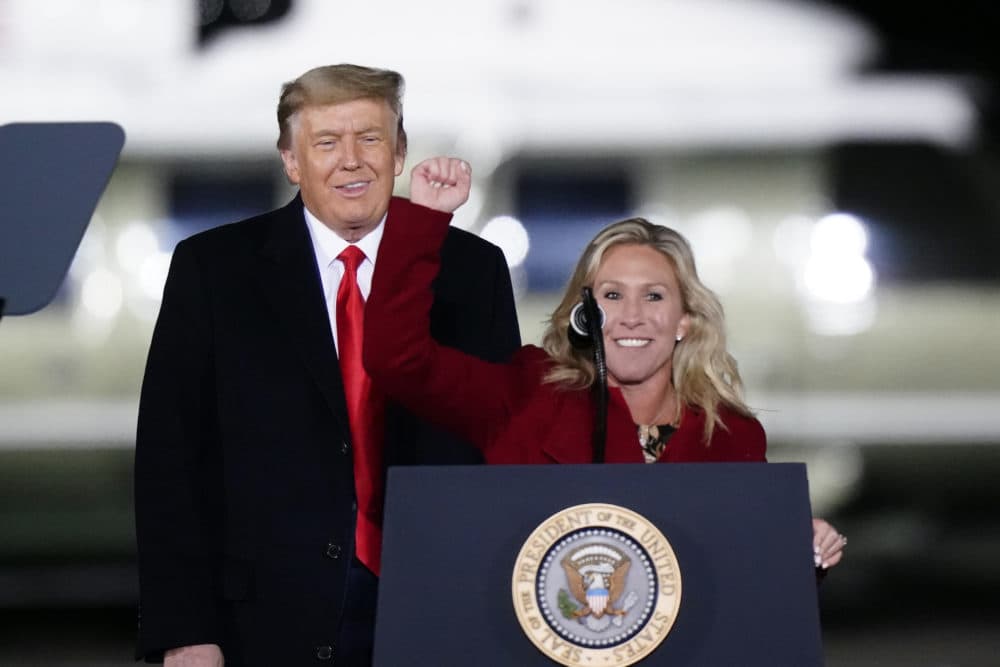 Republican Rep. Marjorie Taylor Greene of Georgia speaks as Trump listens at a campaign rally in support of Senate candidates Kelly Loeffler and David Perdue on Jan. 4, 2021. (Brynn Anderson/AP)