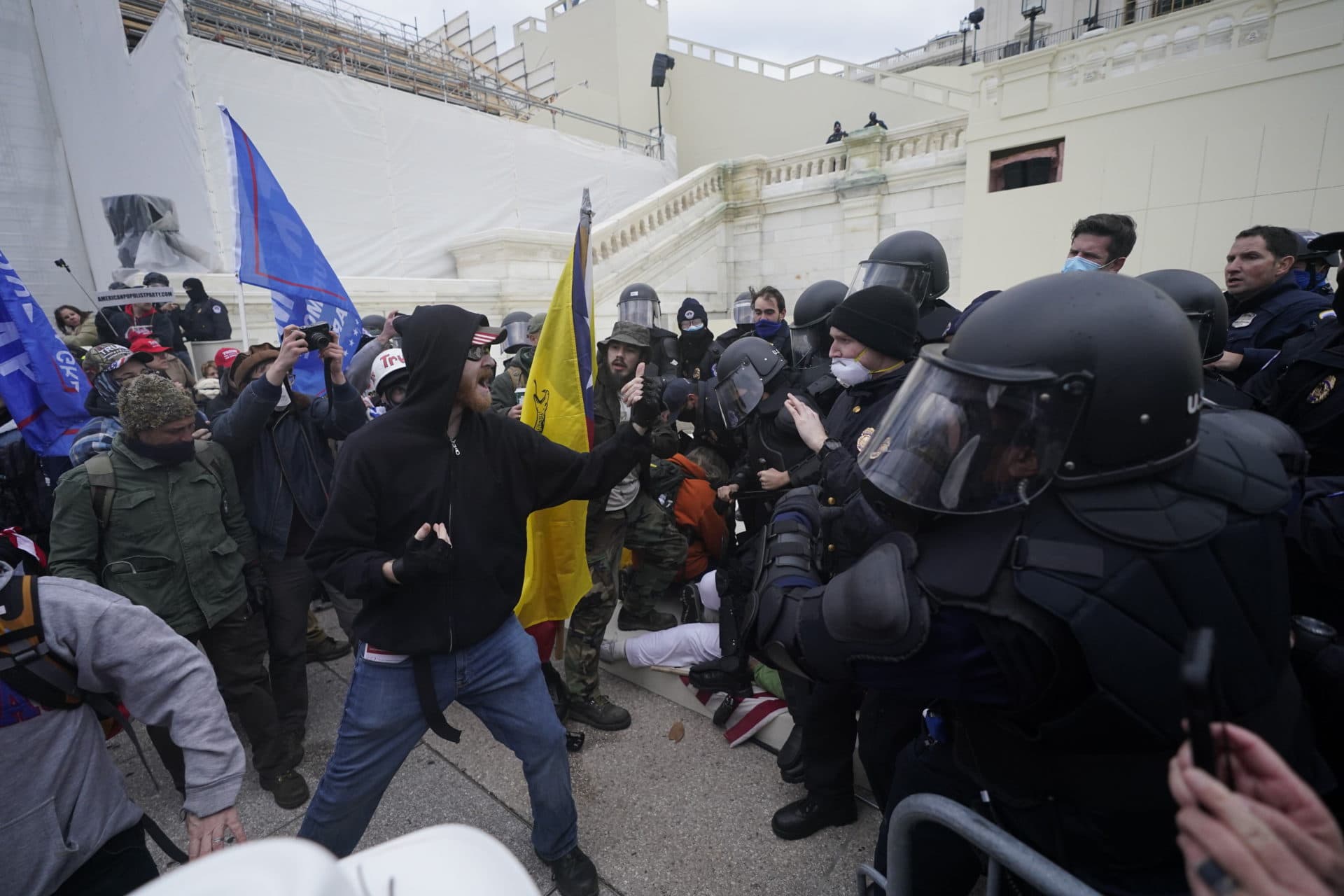 Trump supporters try to break through a police barrier at the Capitol in Washington. (Julio Cortez/AP)