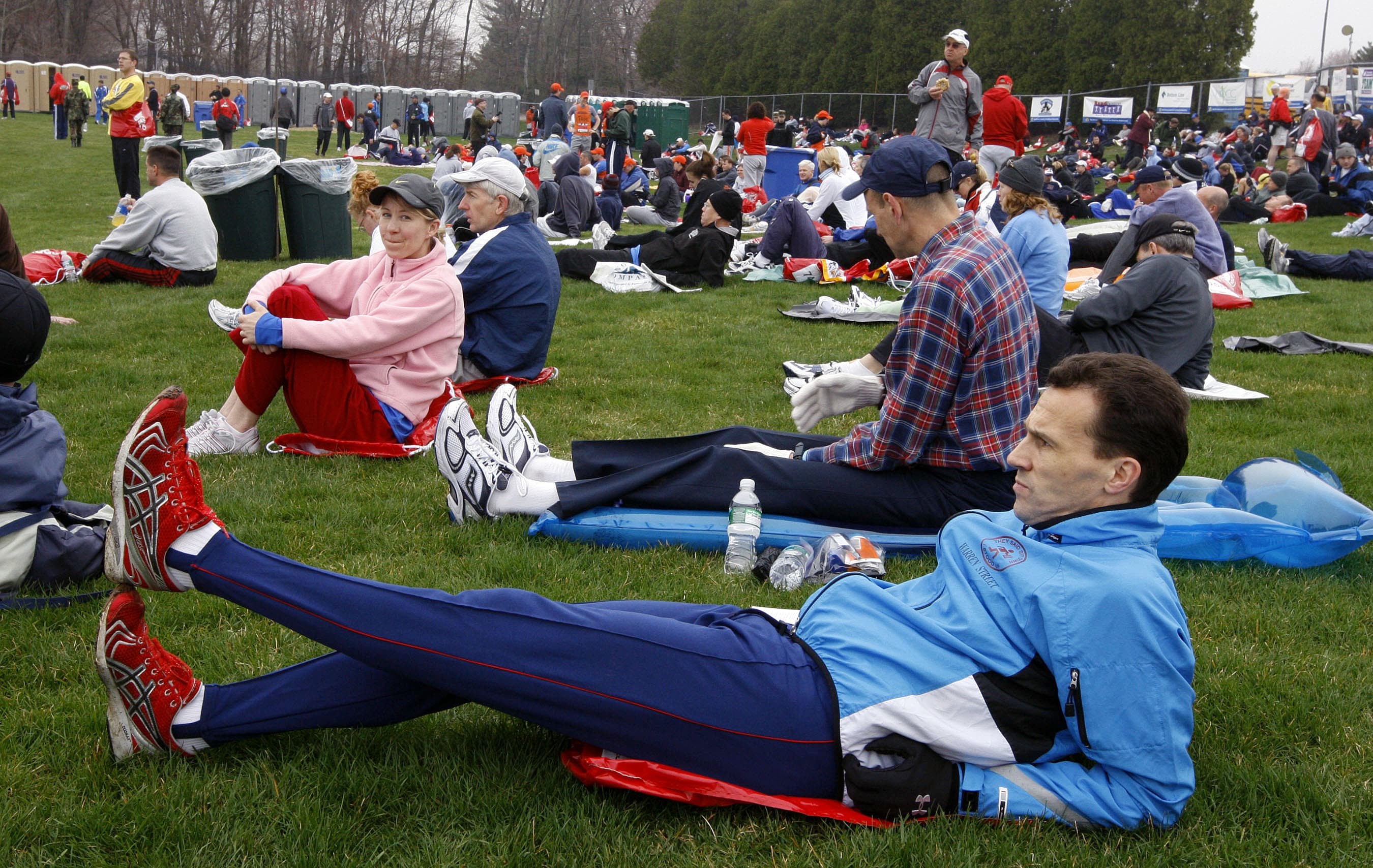 In this April 21, 2008 photo, Paul Thompson of Kettering, England, stretches in the Athlete's Village prior to the start of the 112th Boston Marathon in Hopkinton, Mass. (Bizuayehu Tesfaye/AP)