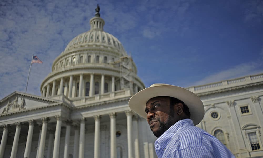 President of the Black Farmers Association John Boyd Jr. protests the non payment of Black farmers in a case settled years ago by meeting with lawmakers and driving his tractor to Capitol Hill in Sept. 2010. (Melina Mara/The Washington Post/Getty Images)