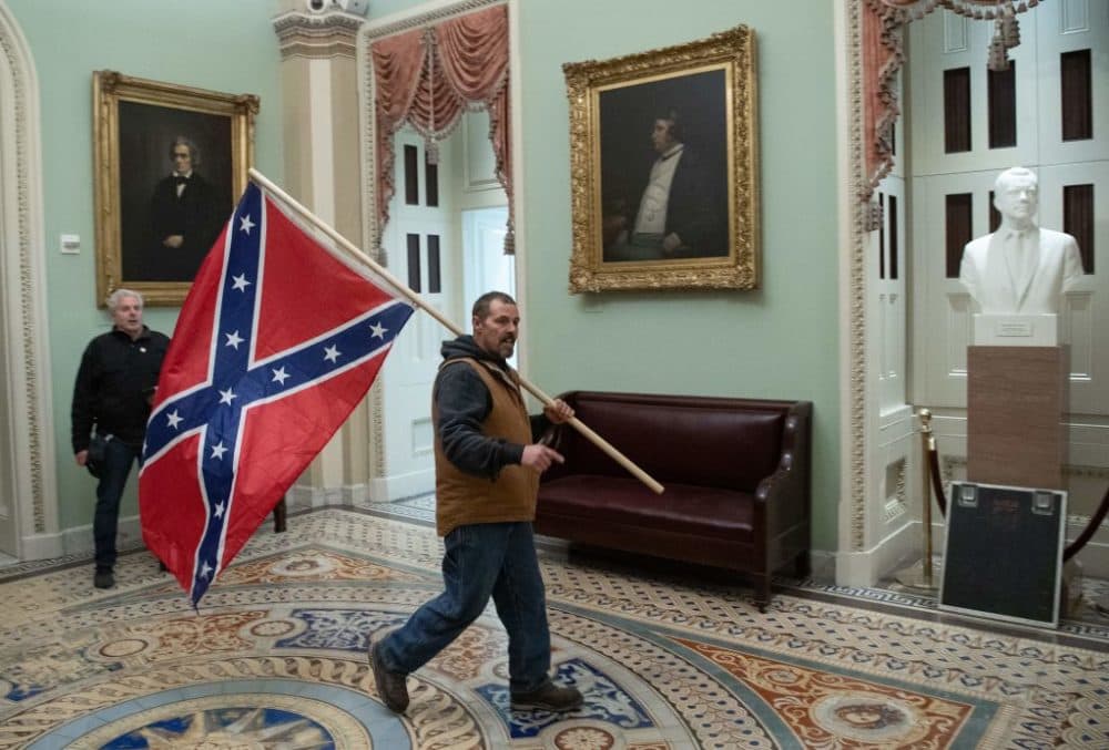 A mob of supporters of President Donald Trump breeched security and entered the Capitol as Congress debated the a 2020 presidential election Electoral Vote Certification on January 6, 2021. (Saul Loeb/AFP via Getty Images)