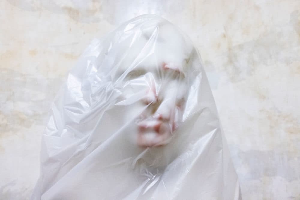 The bust of U.S. President Zachary Taylor is covered with plastic after blood was smeared on it when a pro-Trump mob broke into the U.S. Capitol building on January 7, 2021 in Washington, D.C. (Samuel Corum/Getty Images)