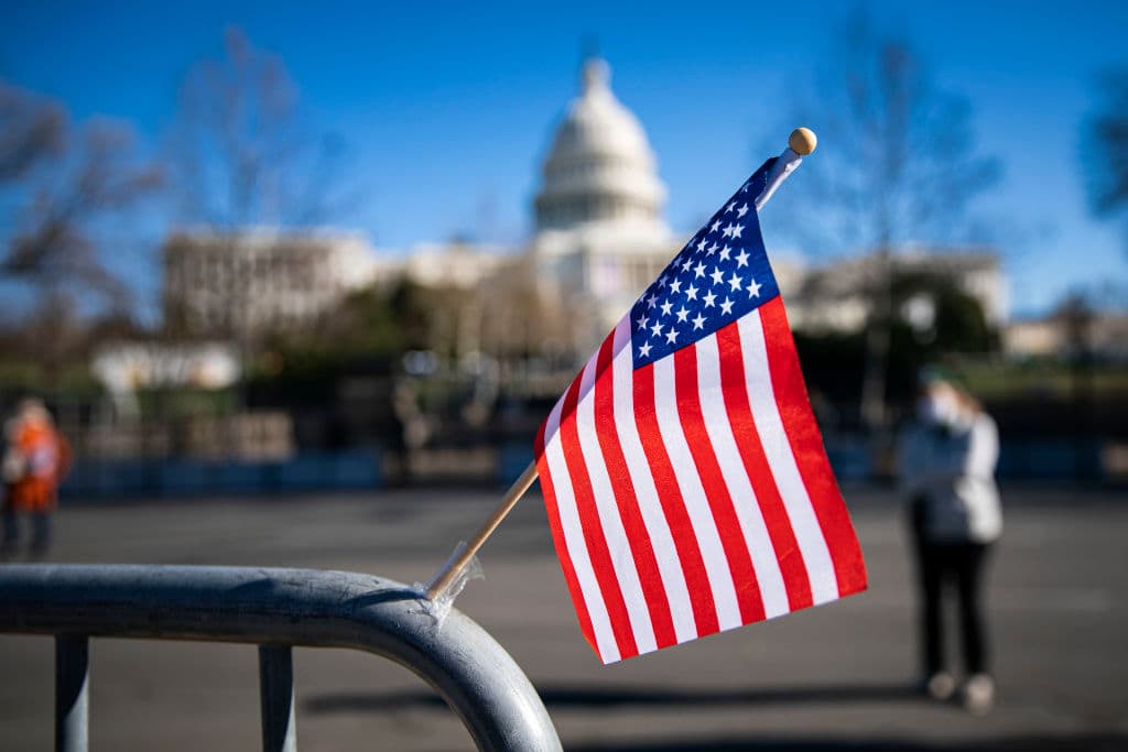 An American flag flies at a makeshift memorial for U.S. Capitol Police Officer Brian Sicknick on January 9, 2021. Sicknick was fatally injured when a pro-Trump mob stormed and entered the Capitol Building. (Al Drago/Getty Images)