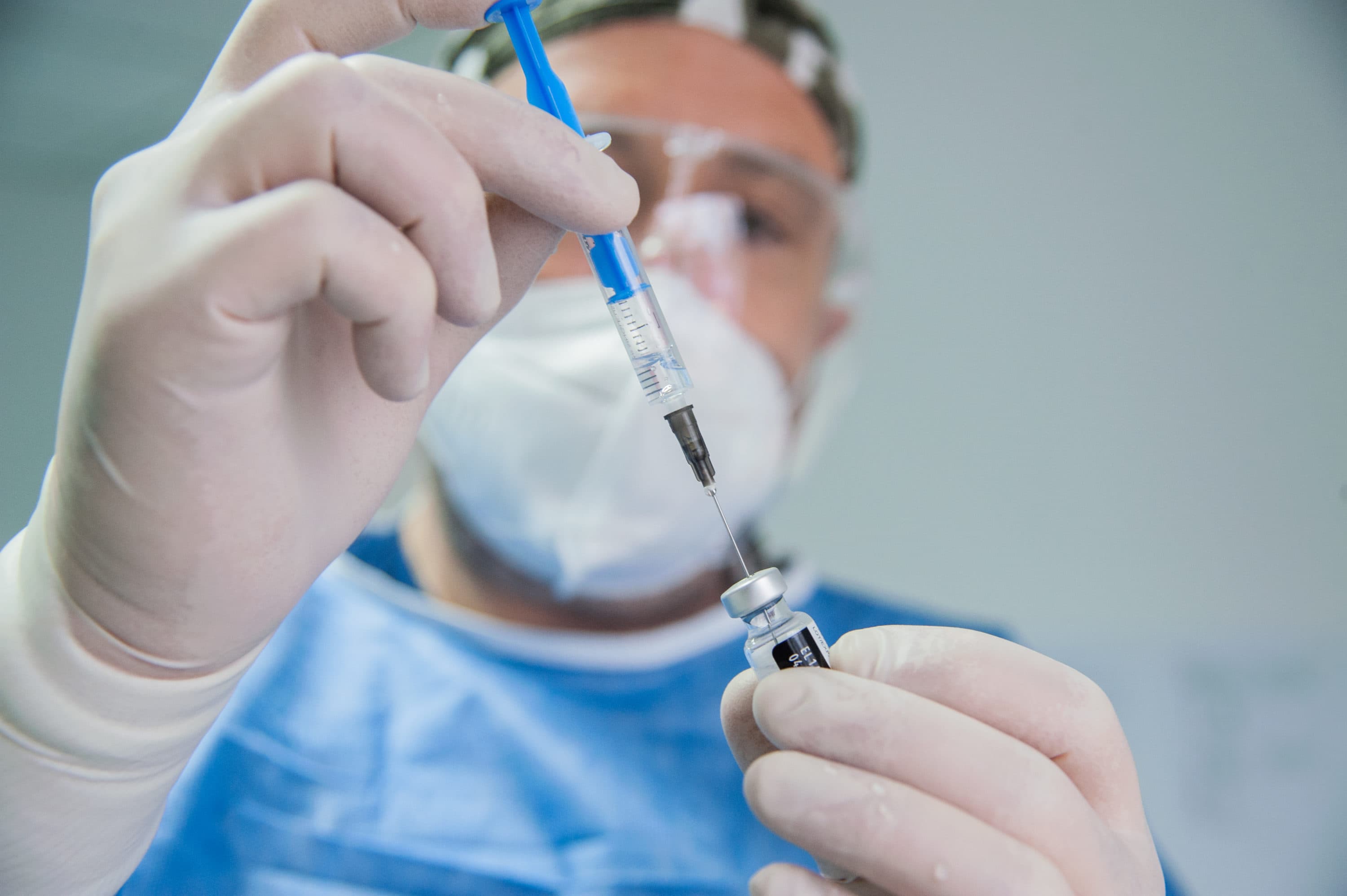 A doctor a prepares a syringe with the Pfizer-BioNtech COVID-19 vaccine. (Hristo Rusev/Getty Images)
