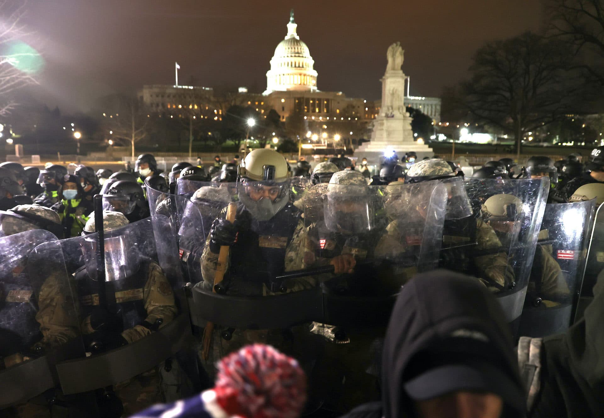 Members of the National Guard assist police officers in dispersing protesters gathered at the U.S. Capitol Building on Jan. 6. (Tasos Katopodis/Getty Images)