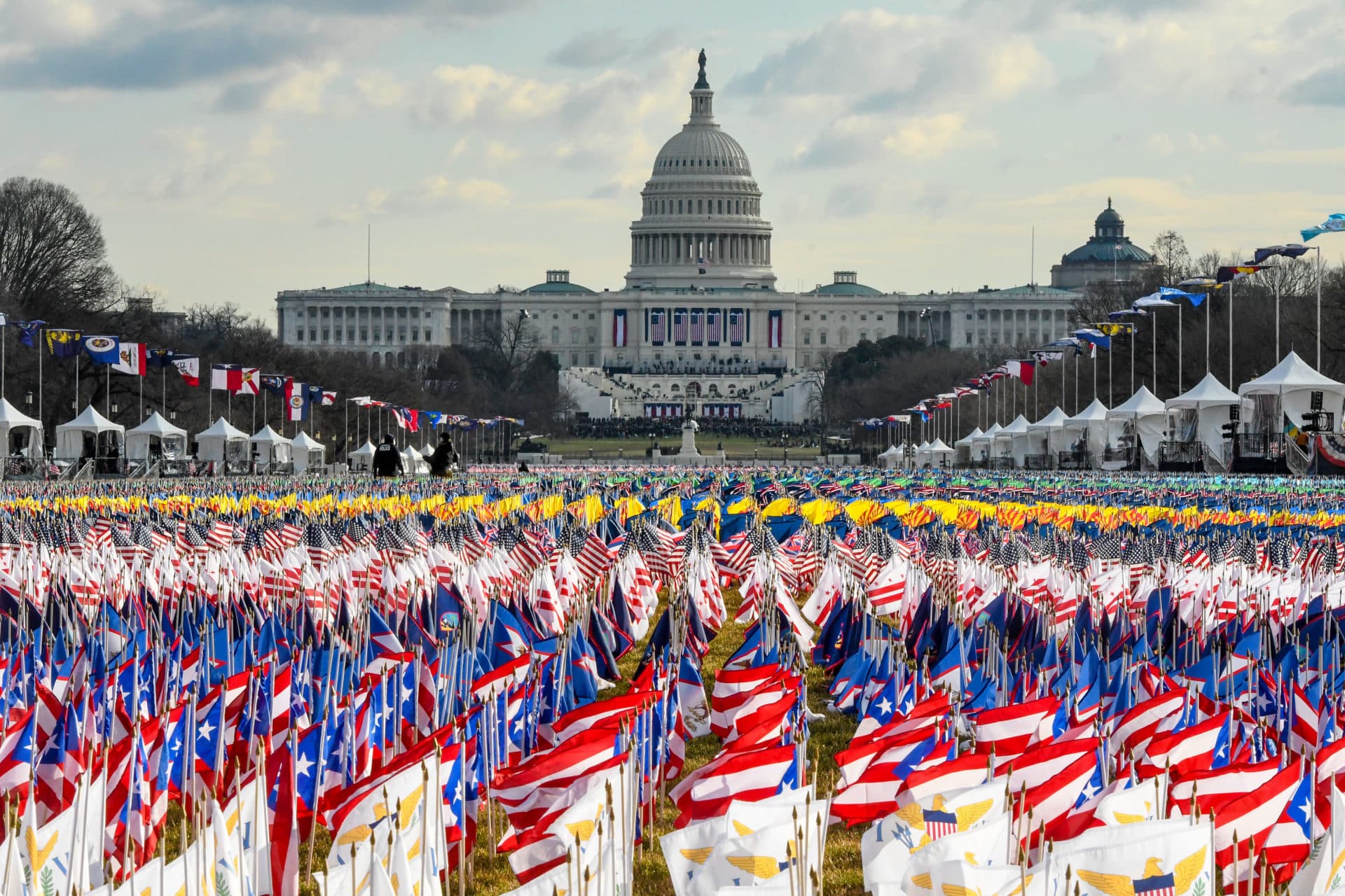 Flags line the National Mall in front of the U.S. Capitol in place of members of the public who could not attend because of the pandemic. (Stephanie Keith/Getty Images)
