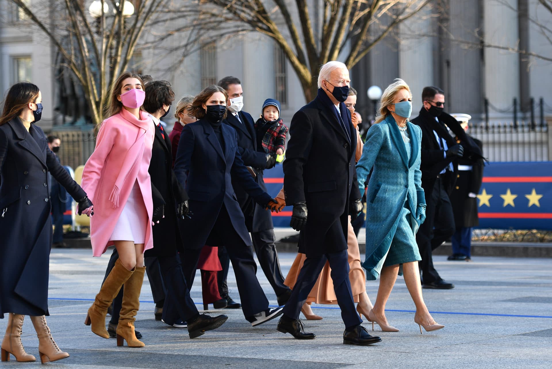 President Joe Biden, First Lady Dr. Jill Biden and family walk the abbreviated parade route after Biden's inauguration. (Mark Makela/Getty Images)