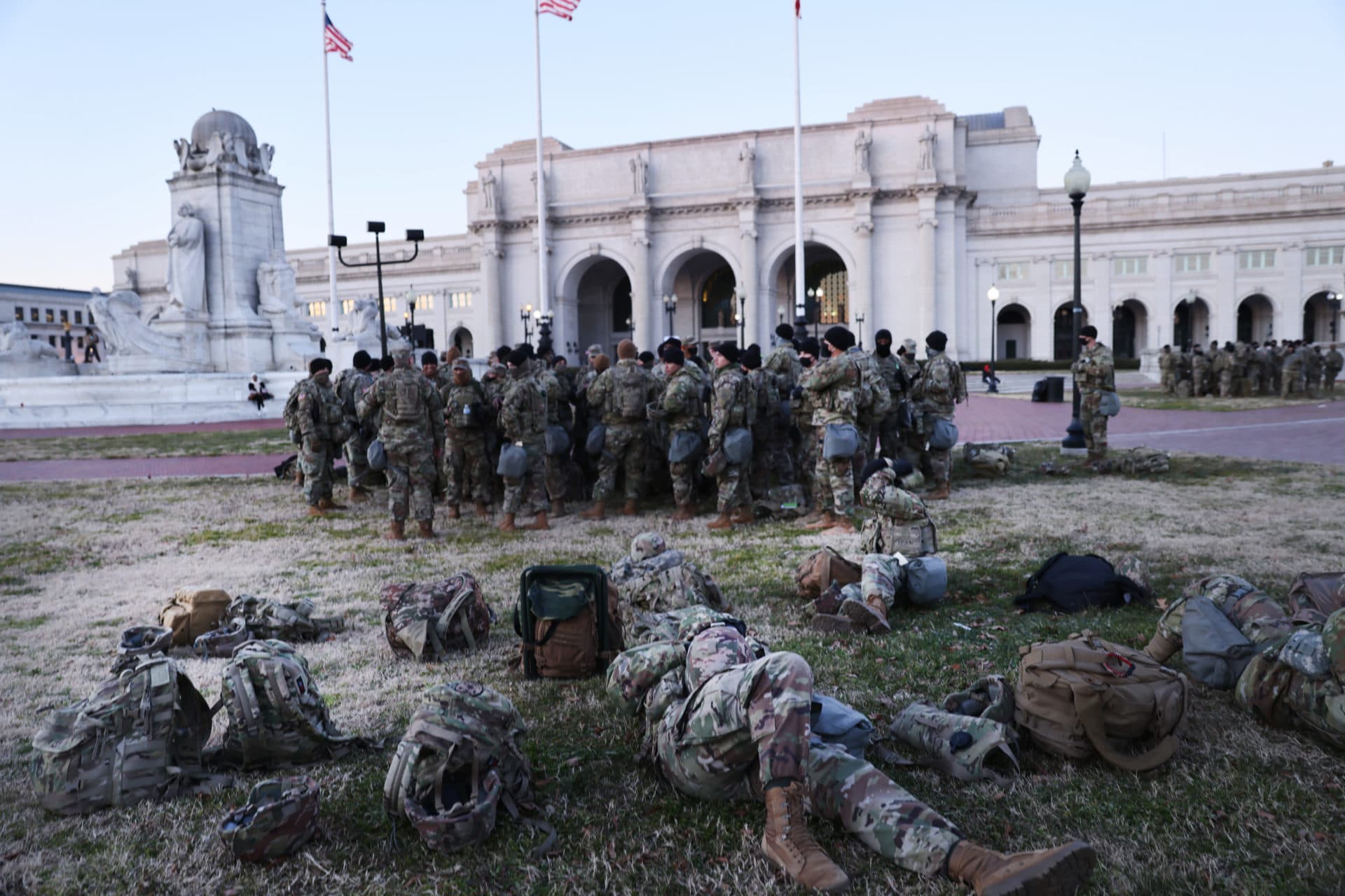 Members of the National Guard wait to depart Union Station as the city remains under tight security on Inauguration Day. (Spencer Platt/Getty Images)